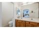 Bright bathroom featuring double sinks and a view into the bedroom at 1718 W Colter St # 184, Phoenix, AZ 85015