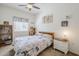 Bedroom featuring neutral tones, a ceiling fan, and an Eiffel Tower decor at 1718 W Colter St # 184, Phoenix, AZ 85015