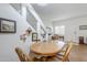 Cozy dining area featuring a wood table and chairs, with decor on the stairway wall at 1718 W Colter St # 184, Phoenix, AZ 85015