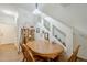 Cozy dining area with a classic wood table set beside the stairway to the upper level at 1718 W Colter St # 184, Phoenix, AZ 85015