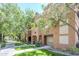 Inviting multi-story condo featuring lush green landscaping and a well-maintained exterior at 1718 W Colter St # 184, Phoenix, AZ 85015