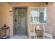 Welcoming condo front door decorated with a festive wreath, complemented by stylish outdoor decor at 1718 W Colter St # 184, Phoenix, AZ 85015