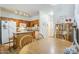 Charming kitchen connected to the dining area featuring wood cabinets and modern appliances at 1718 W Colter St # 184, Phoenix, AZ 85015