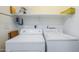Laundry room featuring a washer, a dryer, and shelving at 1718 W Colter St # 184, Phoenix, AZ 85015