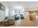 Open-concept living space flowing into kitchen with modern wood flooring and plenty of natural light at 1718 W Colter St # 184, Phoenix, AZ 85015