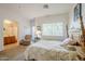 Main bedroom features a full bed, a window with blinds, and an ensuite bathroom at 1718 W Colter St # 184, Phoenix, AZ 85015