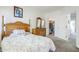 Cozy main bedroom featuring a full bed, dresser, and open door to the closet at 1718 W Colter St # 184, Phoenix, AZ 85015
