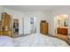 Main bedroom with a full bed, dresser, and open door to closet and bathroom at 1718 W Colter St # 184, Phoenix, AZ 85015