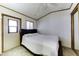 Bedroom features carpet, a ceiling fan, window, door, and mirrored closet at 17200 W Bell Rd # 652, Surprise, AZ 85374