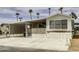 Charming single-story home with a covered parking area and a cozy front porch and meticulously kept landscaping at 17200 W Bell Rd # 652, Surprise, AZ 85374