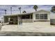 Charming single-story home with a covered parking area and a cozy front porch and meticulously kept landscaping at 17200 W Bell Rd # 652, Surprise, AZ 85374