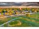 Scenic aerial view of the property showcasing its location on a golf course with picturesque surroundings at 18410 N 104Th Ave, Sun City, AZ 85373