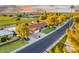 Beautiful neighborhood with well-manicured lawns, mature trees, and convenient street access at 18410 N 104Th Ave, Sun City, AZ 85373