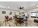 Inviting dining area with stylish furnishings, ceiling fan, and bright windows at 18410 N 104Th Ave, Sun City, AZ 85373