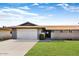 Charming single-story home with a well-maintained lawn, attached garage, and inviting walkway at 18410 N 104Th Ave, Sun City, AZ 85373