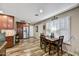 Well-lit kitchen with stainless steel appliances, granite countertops, and eat-in dining area at 18410 N 104Th Ave, Sun City, AZ 85373