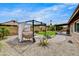 Stylish backyard with a pergola, comfortable seating, and desert landscaping, creating a relaxing oasis at 18601 N 45Th Dr, Glendale, AZ 85308