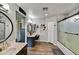 Bright bathroom with dual vanities, updated shower, and ample lighting, creating a refreshing and practical design at 18601 N 45Th Dr, Glendale, AZ 85308