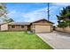 Inviting single-Gathering home with a well-maintained lawn and attached two-car garage at 18601 N 45Th Dr, Glendale, AZ 85308