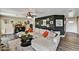 Inviting living room shows hardwood floors, a plush sectional sofa, and stylish decor at 18601 N 45Th Dr, Glendale, AZ 85308