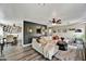 Spacious living room featuring hardwood floors, plush sofa, and adjoins dining area at 18601 N 45Th Dr, Glendale, AZ 85308