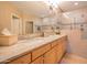 Bathroom featuring dual sinks, tile floors, and a large walk-in shower at 19700 N 76Th St # 2091, Scottsdale, AZ 85255