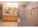 Spacious bathroom featuring a double vanity, and large walk-in shower with stylish tile at 19700 N 76Th St # 2091, Scottsdale, AZ 85255