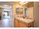 Bright bathroom featuring granite countertops, light wood cabinetry, and tiled floors at 19700 N 76Th St # 2091, Scottsdale, AZ 85255