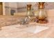 Close-up of a bathroom sink with granite countertop and decorative faucet and sink fixtures at 19700 N 76Th St # 2091, Scottsdale, AZ 85255