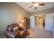 Inviting bedroom featuring a comfortable chair, built in shelving and ample natural light at 19700 N 76Th St # 2091, Scottsdale, AZ 85255