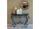 Tasteful hallway decor with vases, decorative mirror, and ornate console table at 19700 N 76Th St # 2091, Scottsdale, AZ 85255