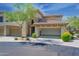 Lovely townhome with desert landscaping and attached 2 car garage with open door at 19700 N 76Th St # 2091, Scottsdale, AZ 85255