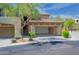 Picture of exterior with view of attached 2 car garage and desert landscaping at 19700 N 76Th St # 2091, Scottsdale, AZ 85255