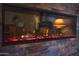Close up of modern fireplace showing colored stones and a contemporary design at 19700 N 76Th St # 2091, Scottsdale, AZ 85255