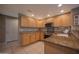 Well-lit kitchen with granite countertops, modern appliances, and ample cabinet space at 19700 N 76Th St # 2091, Scottsdale, AZ 85255