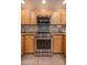 This kitchen features stainless steel KitchenAid oven and microwave, as well as tile backsplash at 19700 N 76Th St # 2091, Scottsdale, AZ 85255