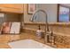 Close up of kitchen sink featuring granite countertops and stainless steel faucet at 19700 N 76Th St # 2091, Scottsdale, AZ 85255