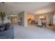 Spacious living room with neutral tones, open layout to kitchen, and comfortable furnishings at 19700 N 76Th St # 2091, Scottsdale, AZ 85255