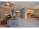 Bright living room featuring plush carpeting, cozy seating, and an open floor plan at 19700 N 76Th St # 2091, Scottsdale, AZ 85255
