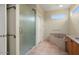 Bathroom featuring a glass-enclosed shower and soaking tub at 20017 N Cielo Ct, Surprise, AZ 85374