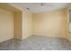 Spacious bedroom with neutral walls, tile flooring, and ceiling fan at 20017 N Cielo Ct, Surprise, AZ 85374