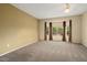 This bedroom features neutral walls, carpet flooring, and a bay window at 20017 N Cielo Ct, Surprise, AZ 85374