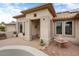 Well-maintained front entrance with neutral tones, decorative landscaping, and custom details at 20017 N Cielo Ct, Surprise, AZ 85374