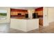 Kitchen features granite countertops, wood cabinets, stainless appliances, and tile flooring at 20017 N Cielo Ct, Surprise, AZ 85374