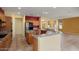 Well-equipped kitchen with granite countertops, tile floors, stainless appliances, and breakfast bar at 20017 N Cielo Ct, Surprise, AZ 85374