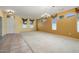 Large living room with carpet, tile floor, ceiling fan, chandelier, and plenty of light at 20017 N Cielo Ct, Surprise, AZ 85374