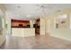 Open-concept living room showcases ceramic tile flooring, recessed lighting, and kitchen island at 20017 N Cielo Ct, Surprise, AZ 85374