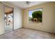Sitting room with tile floors, access to backyard, and large windows overlooking the backyard at 20017 N Cielo Ct, Surprise, AZ 85374