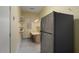 Storage room with a refrigerator, shelving, and a worktable with drawers at 20017 N Cielo Ct, Surprise, AZ 85374