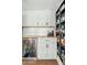 Stylish home bar with storage for beverages, cabinets, and mini fridge at 2026 S Emerson --, Mesa, AZ 85210